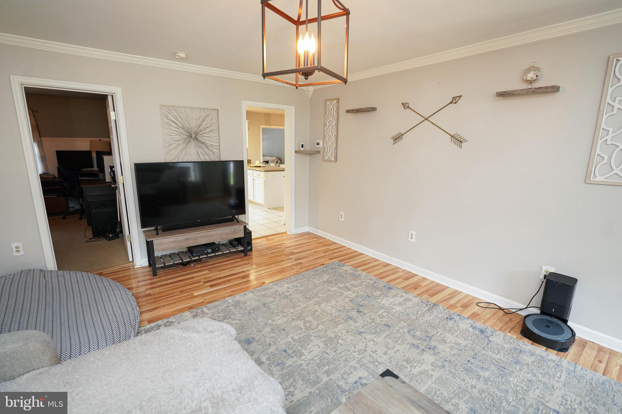 3727 Village Trail Snow Hill, MD 21863 - Photo 12 of 75 a living room with furniture and a flat screen tv