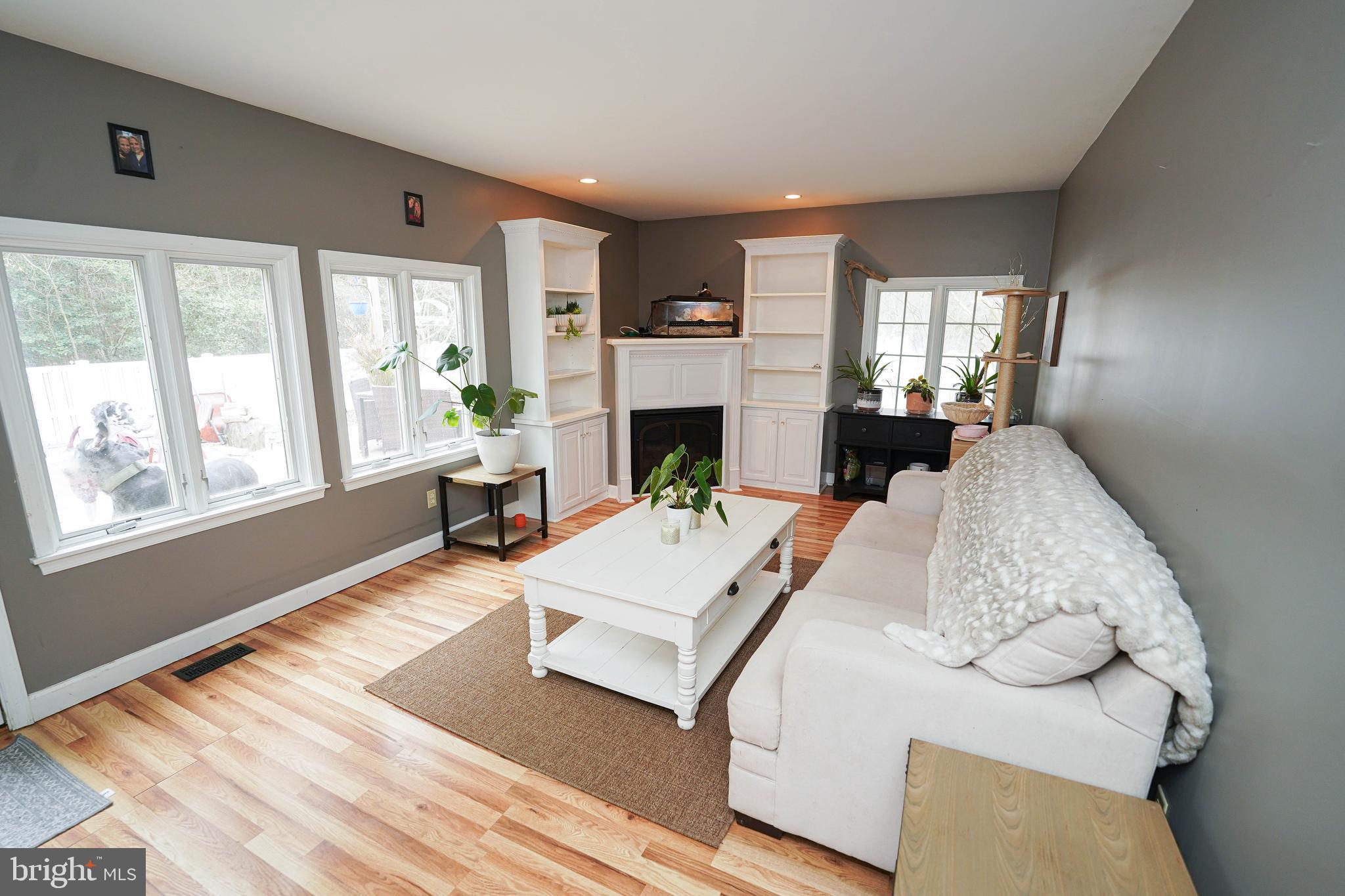 3727 Village Trail Snow Hill, MD 21863 - Photo 29 of 75 a living room with furniture fireplace and window