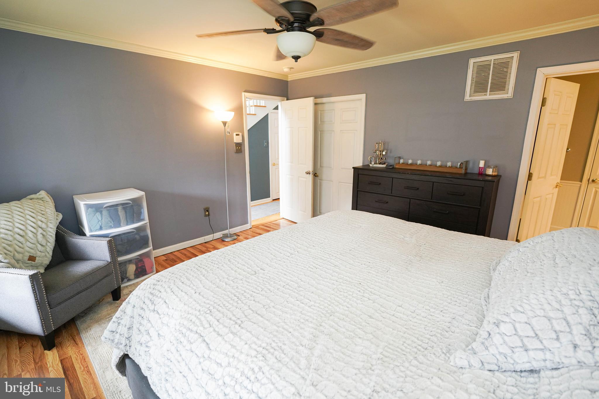 3727 Village Trail Snow Hill, MD 21863 - Photo 35 of 75 a bedroom with a bed and wooden floor