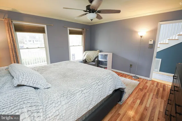 a bathroom with a sink a toilet and shower curtain