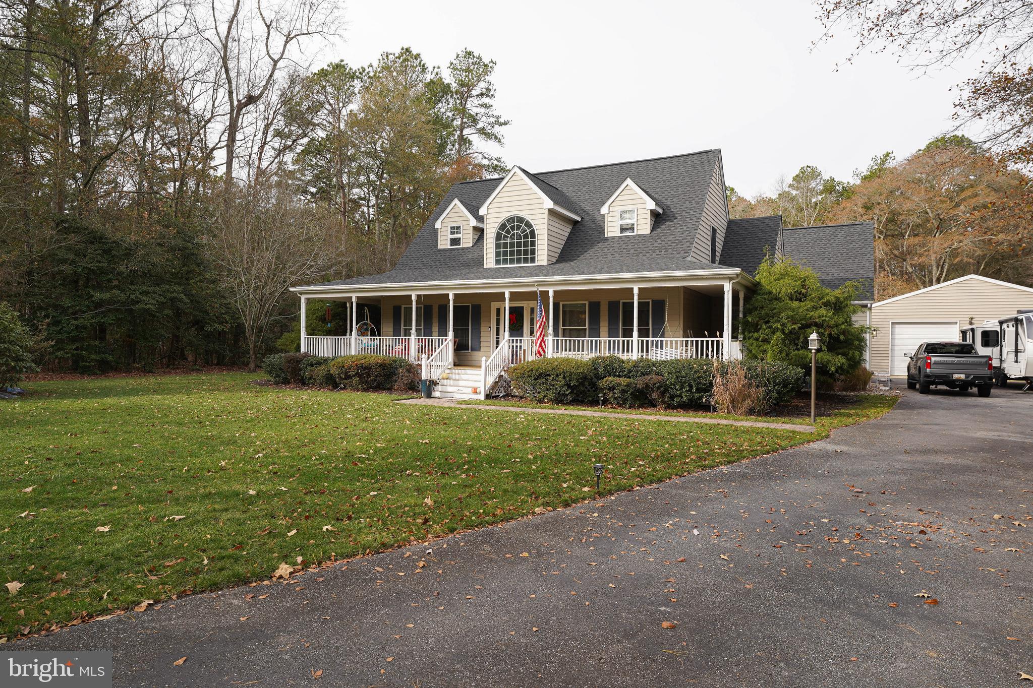 3727 Village Trail Snow Hill, MD 21863 - Photo 4 of 75 a front view of a house with a yard and trees