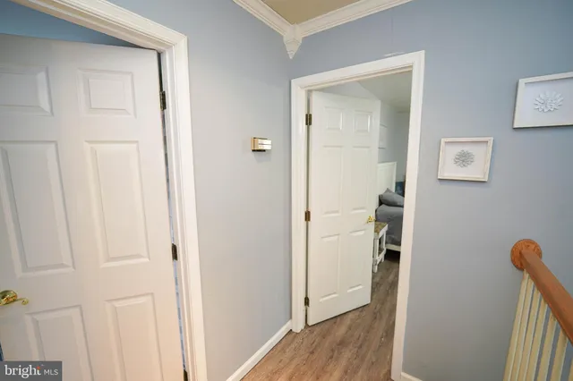 a view of a chairs and table in the back yard of the house