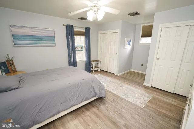 a view of a patio with table and chairs with wooden fence