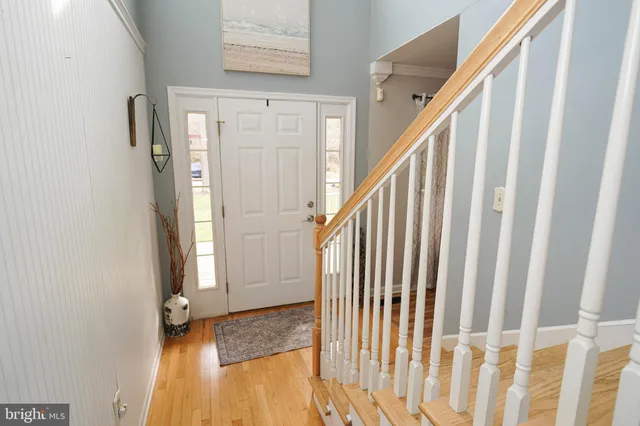 a view of an entryway with wooden floor