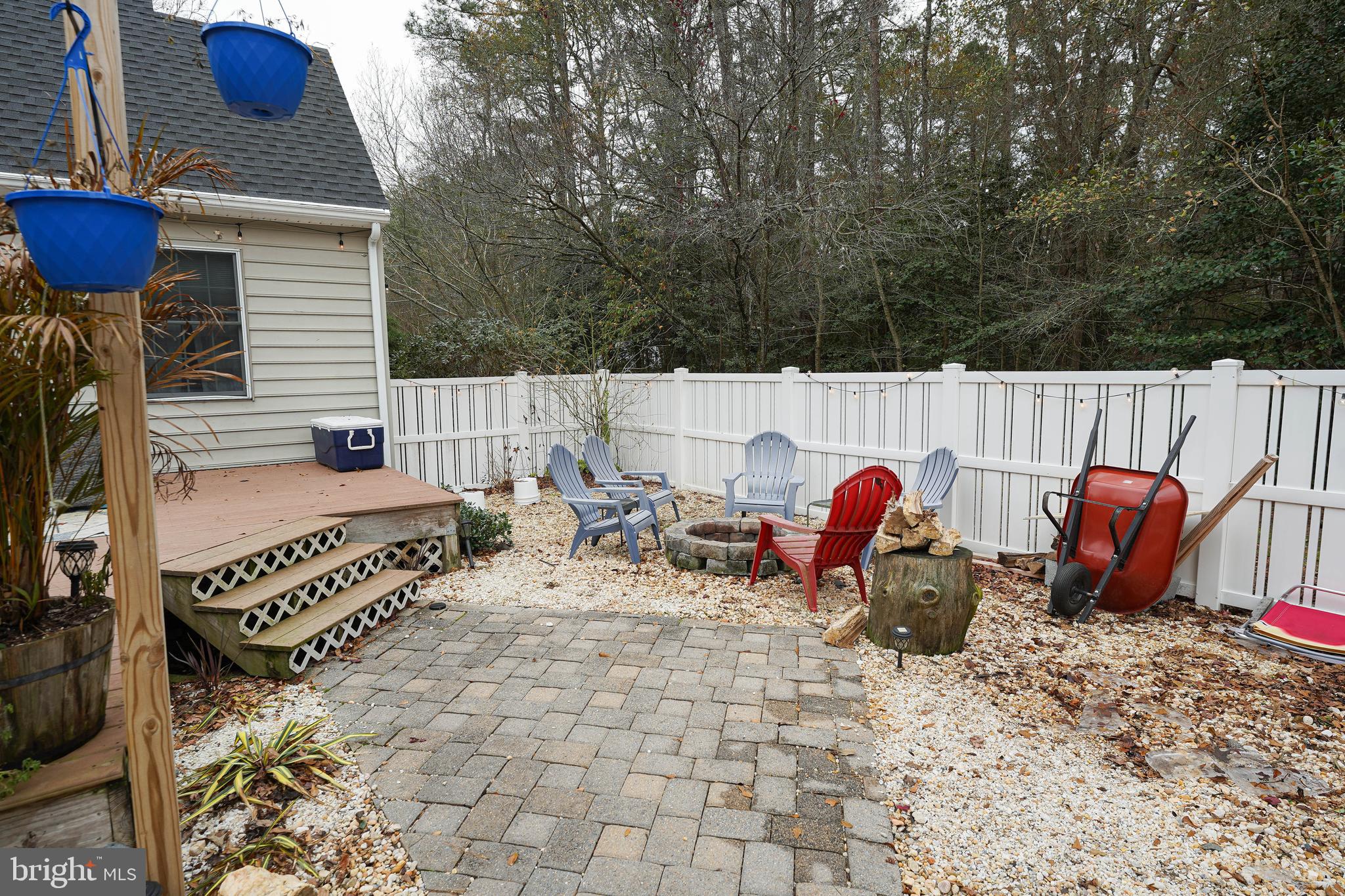 3727 Village Trail Snow Hill, MD 21863 - Photo 70 of 75 a view of a chairs and table in the back yard of the house