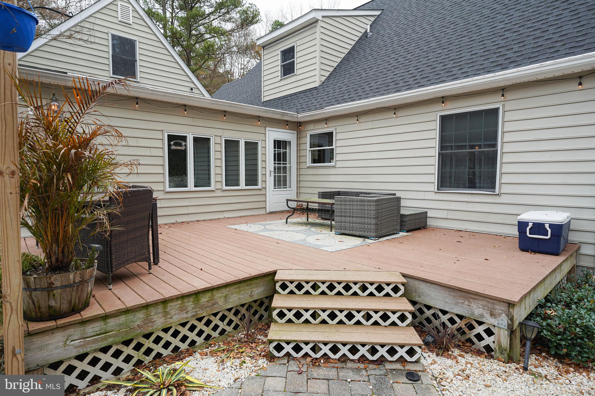3727 Village Trail Snow Hill, MD 21863 - Photo 71 of 75 a view of a patio with table and chairs with wooden fence