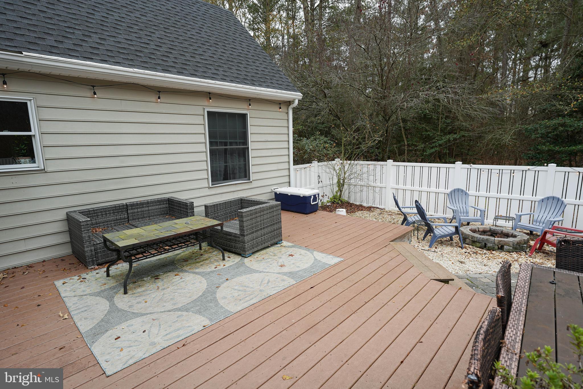 3727 Village Trail Snow Hill, MD 21863 - Photo 72 of 75 a view of a roof deck with wooden floor and a bench