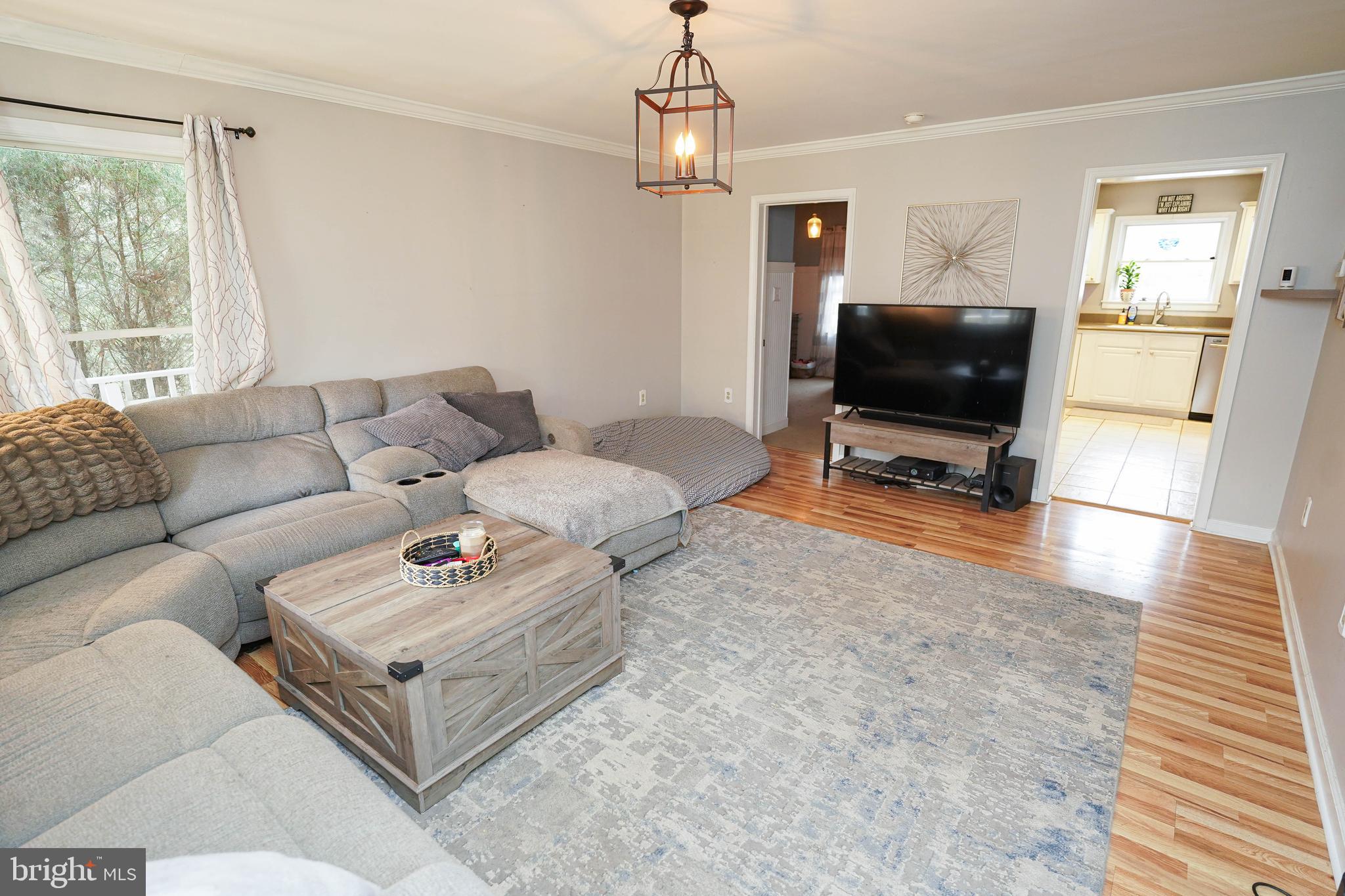 3727 Village Trail Snow Hill, MD 21863 - Photo 9 of 75 a living room with furniture and a flat screen tv