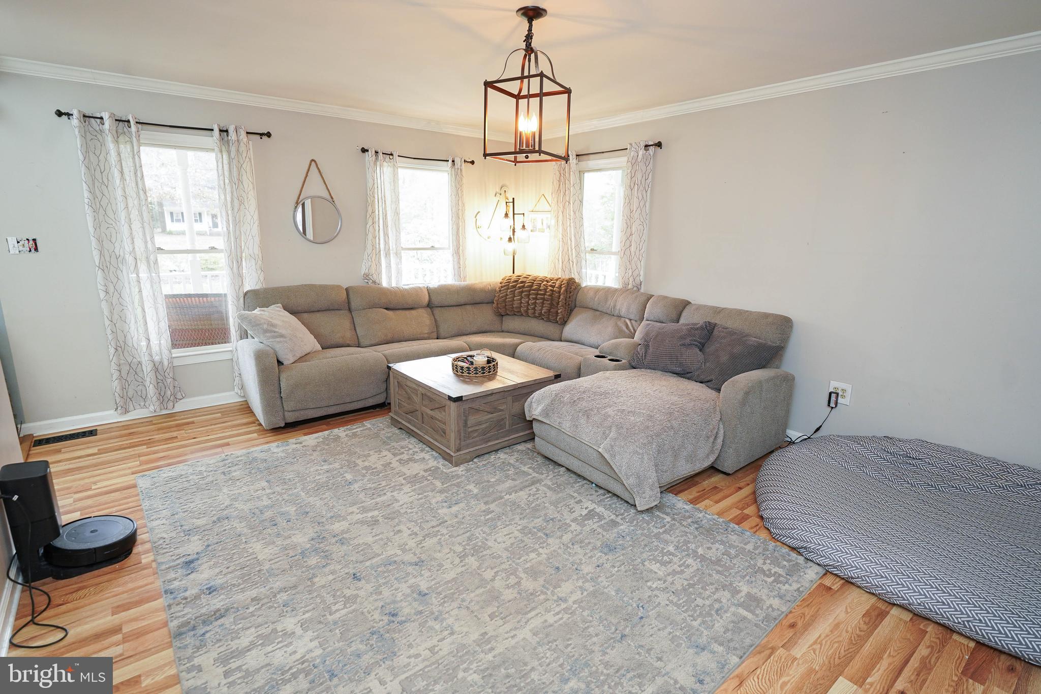 3727 Village Trail Snow Hill, MD 21863 - Photo 10 of 75 a living room with furniture and a window