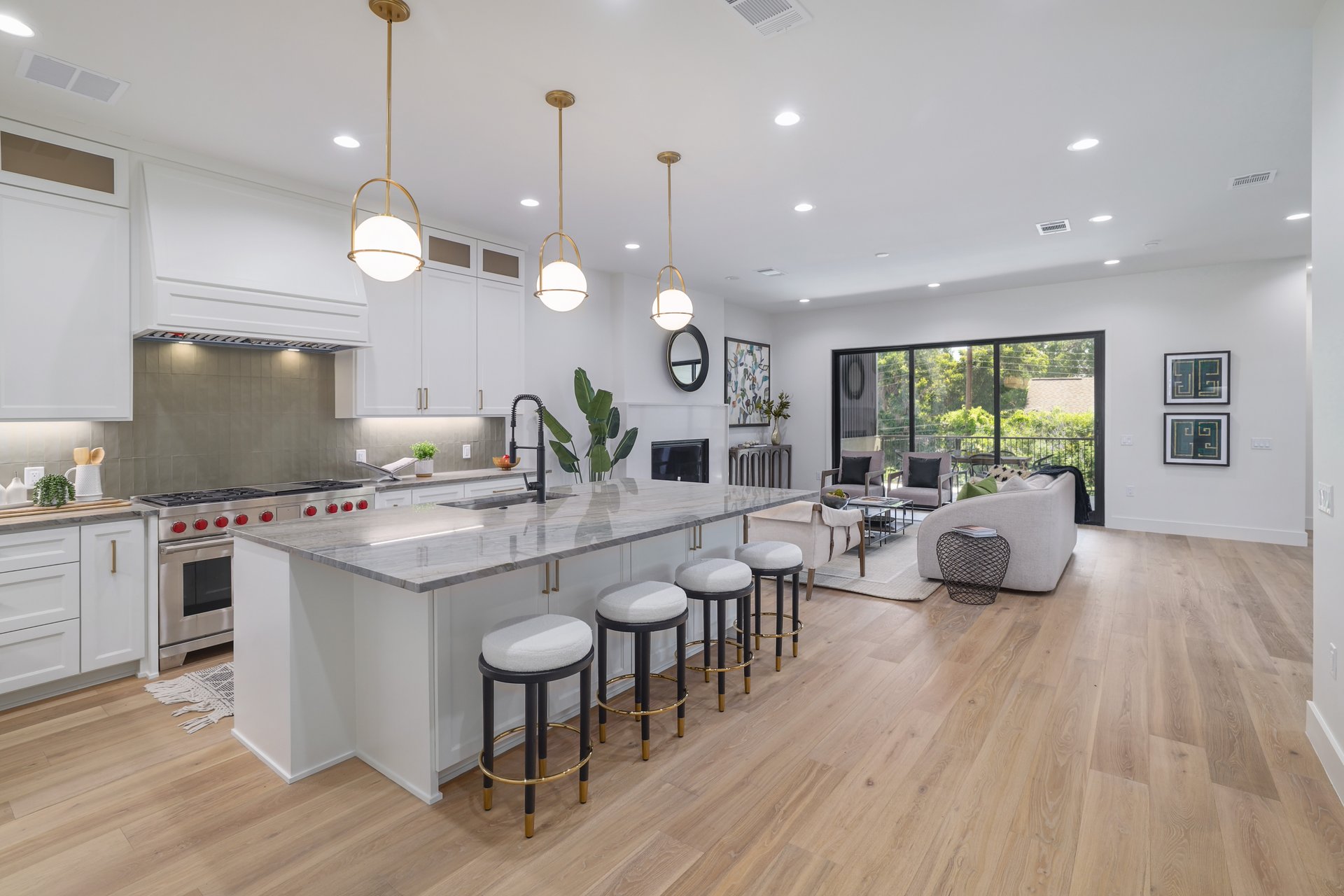 a large kitchen with a table and chairs