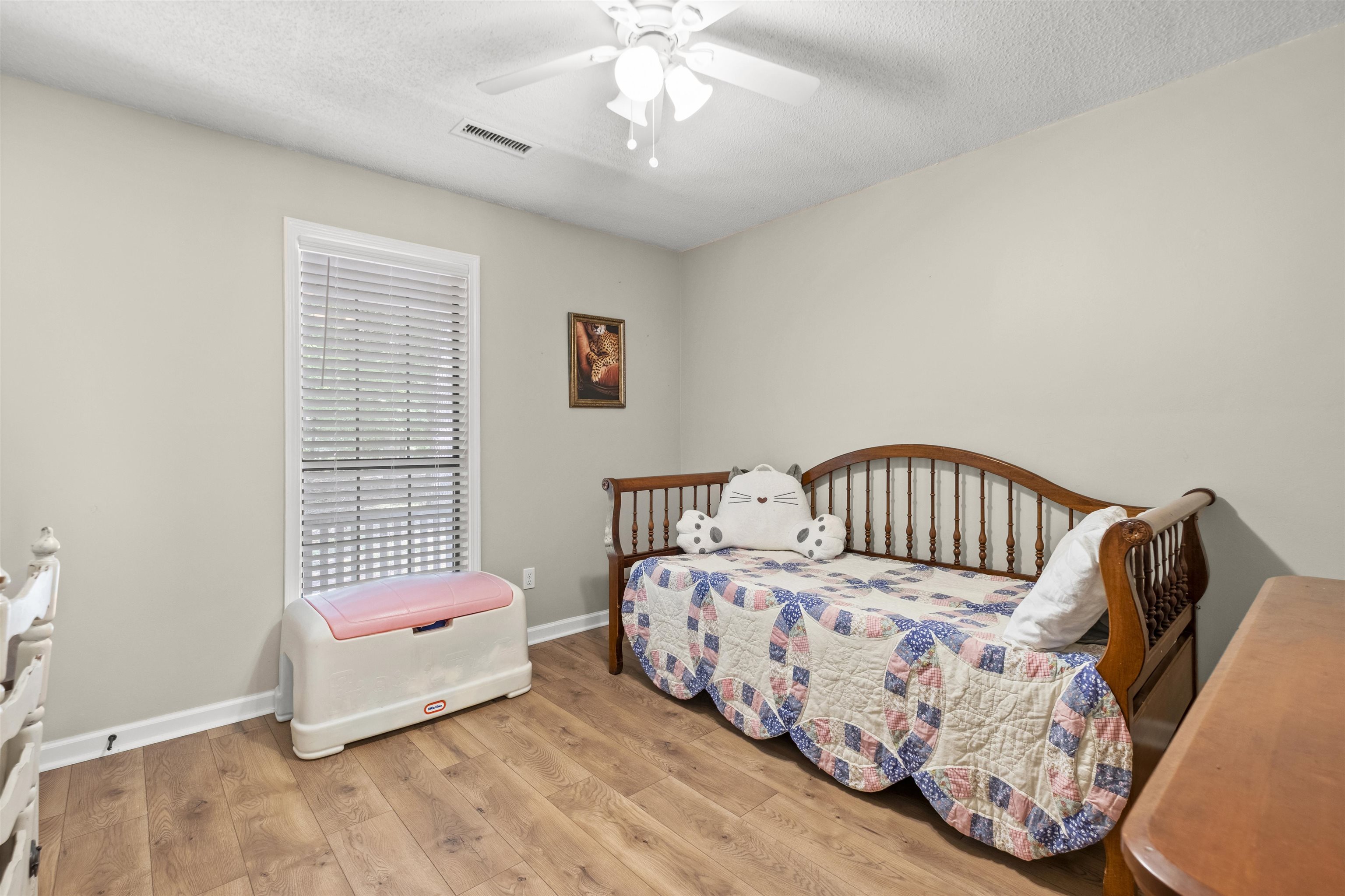 3601 Marshall Road Munford, TN 38058 - Photo 32 of 35 Room featuring wood-finish flooring, light-toned walls, and a ceiling fan with integrated lighting