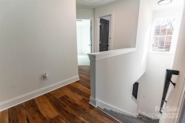 a view of entryway with wooden floor