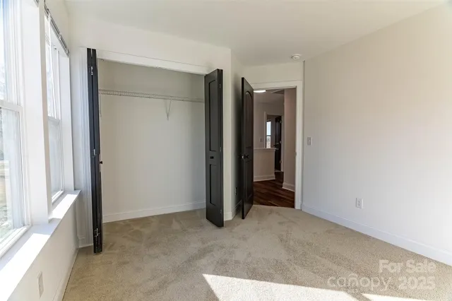 a view of hallway with closet