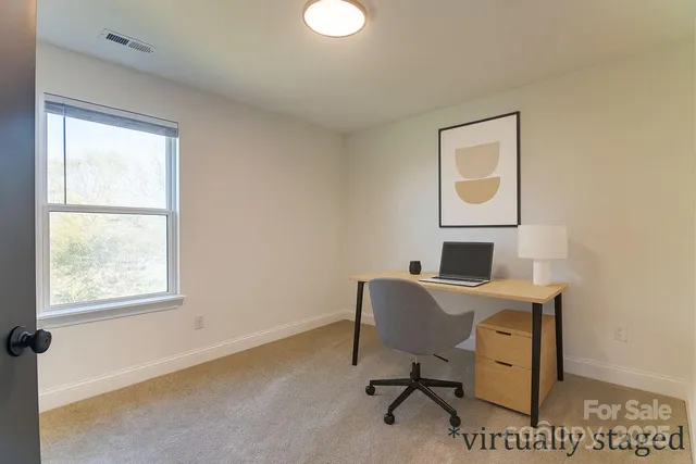 a workspace with furniture and a window