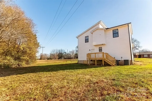 a view of a patio with chairs and a yard
