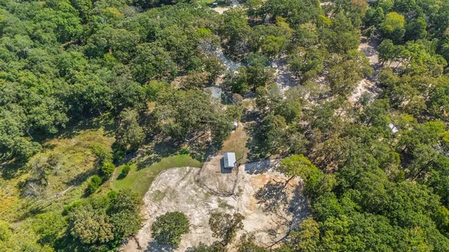 a backyard of a house with a yard and fountain