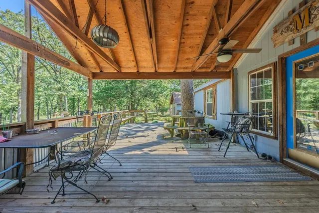 a outdoor space with lots of furniture and wooden floor