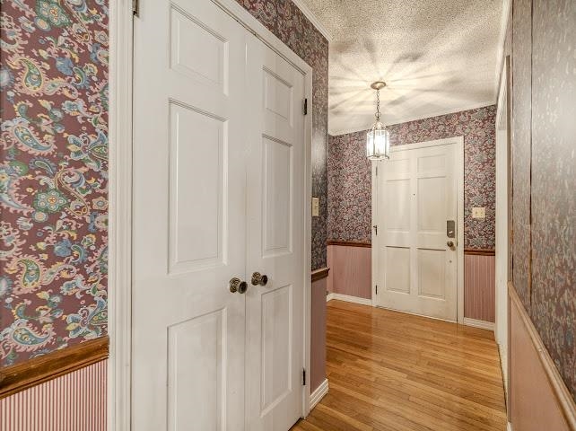 660 Hinton Road Counce, TN 38326 - Photo 15 of 40 Wood-finish flooring complemented by a hanging chandelier light fixture