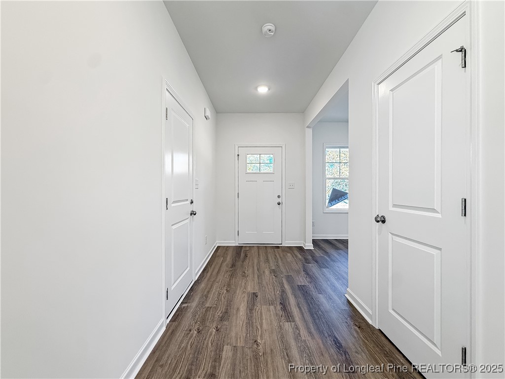1020 Alex Baker (lot 9) Road Raeford, NC 28376 - Photo 2 of 31 a view of a hallway with wooden floor