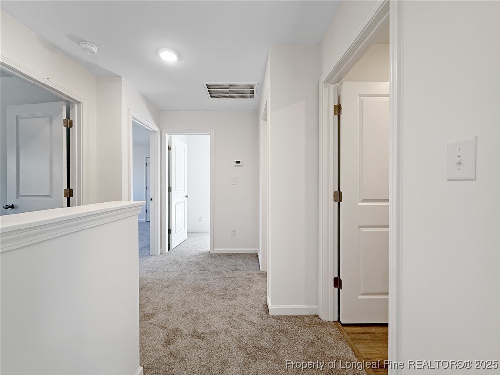 1020 Alex Baker (lot 9) Road Raeford, NC 28376 - Photo 24 of 31 a view of a hallway with closet and mirror