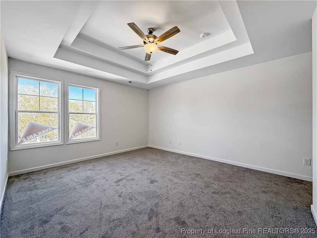 1020 Alex Baker (lot 9) Road Raeford, NC 28376 - Photo 25 of 31 an empty room with ceiling fan and window