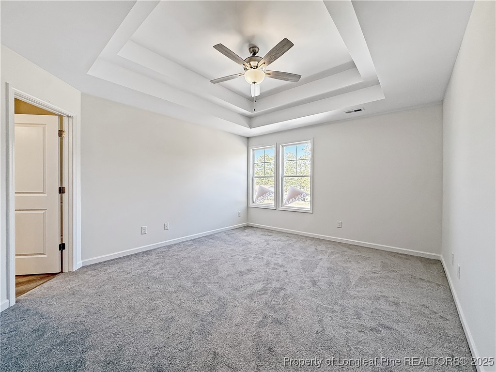 1020 Alex Baker (lot 9) Road Raeford, NC 28376 - Photo 26 of 31 an empty room with ceiling fan and window