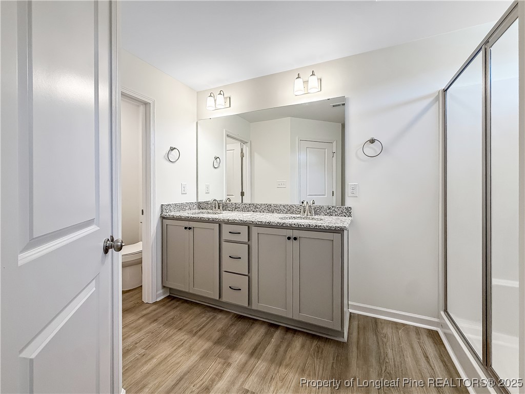 1020 Alex Baker (lot 9) Road Raeford, NC 28376 - Photo 28 of 31 a bathroom with a granite countertop sink and a mirror