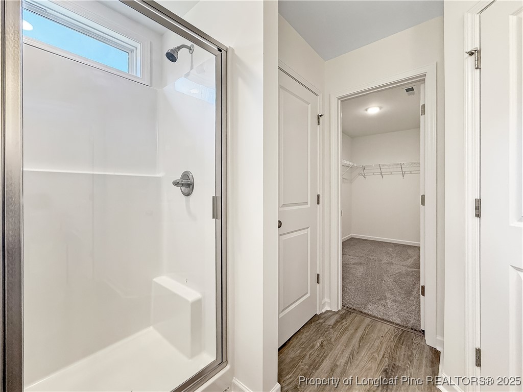 1020 Alex Baker (lot 9) Road Raeford, NC 28376 - Photo 29 of 31 a bathroom with a shower and a glass door