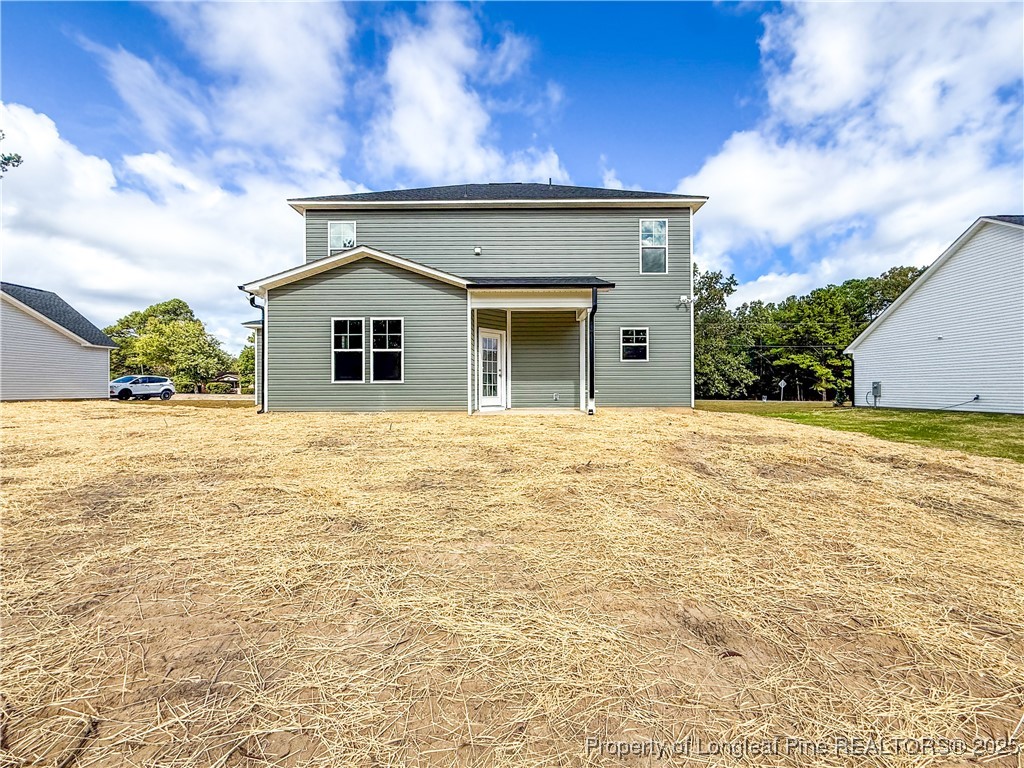 1020 Alex Baker (lot 9) Road Raeford, NC 28376 - Photo 31 of 31 a view of a house with a yard