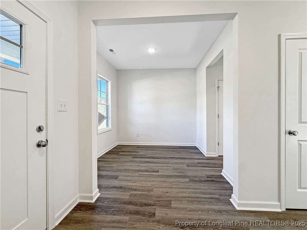 1020 Alex Baker (lot 9) Road Raeford, NC 28376 - Photo 5 of 31 a view of an empty room with wooden floor and a window