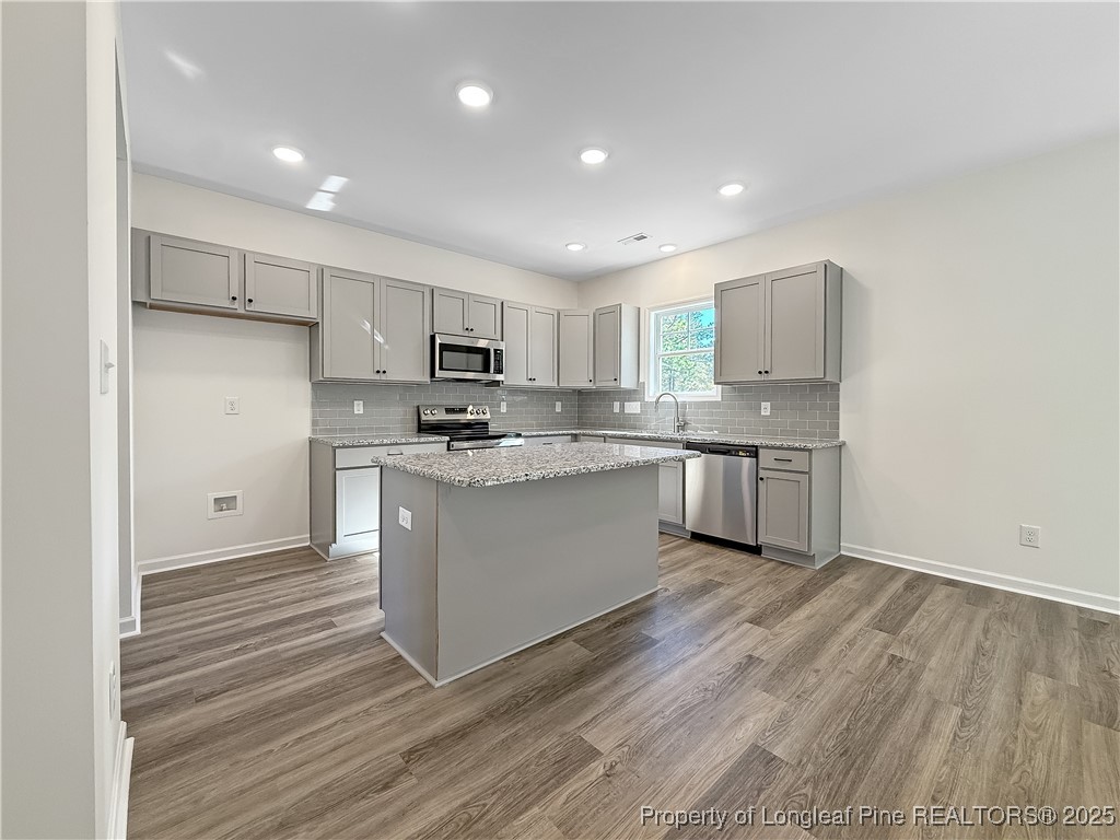 1020 Alex Baker (lot 9) Road Raeford, NC 28376 - Photo 9 of 31 a kitchen with a white cabinets and white appliances