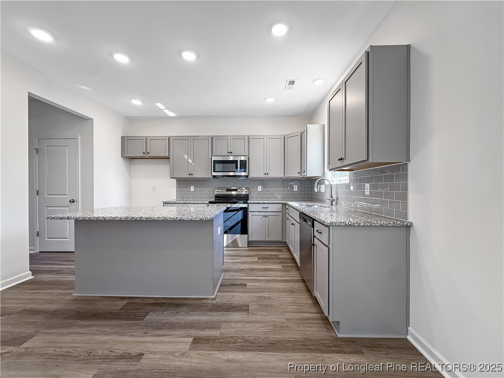 1020 Alex Baker (lot 9) Road Raeford, NC 28376 - Photo 10 of 31 a large kitchen with stainless steel appliances lots of counter space sink and a refrigerator