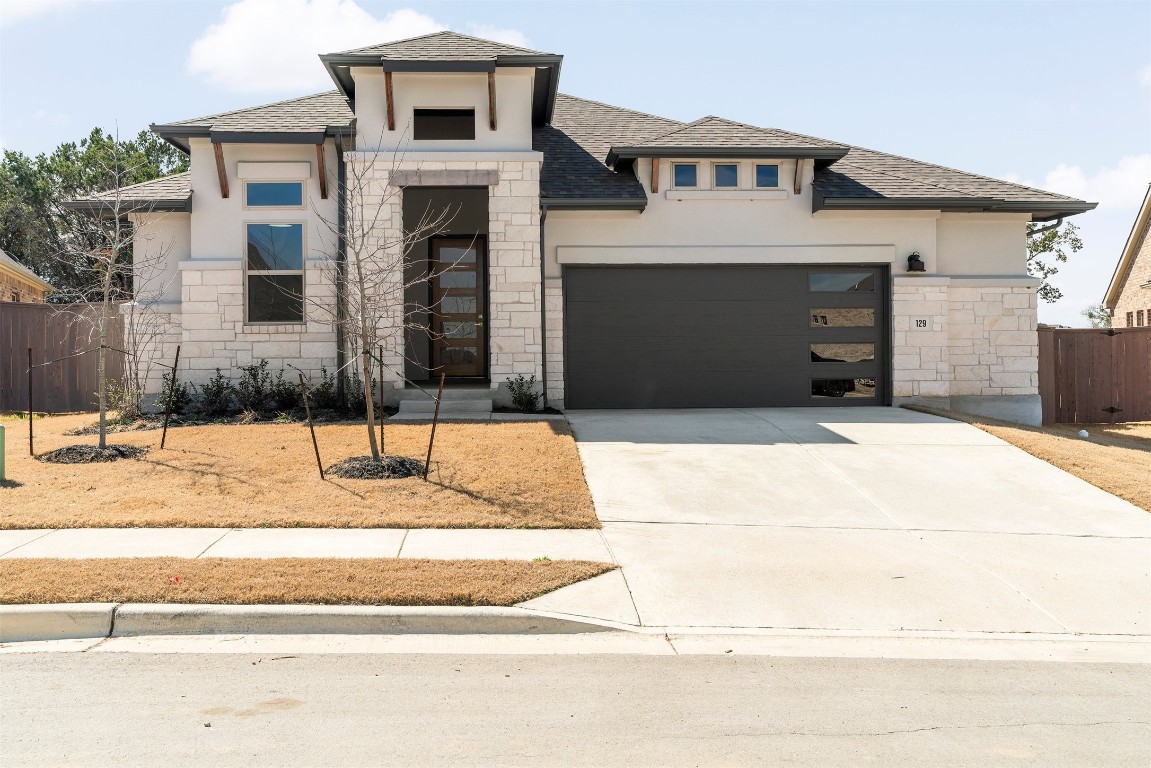 129 Du Bois Lane Kyle, TX 78640 - Photo 1 of 1 a front view of a house with yard