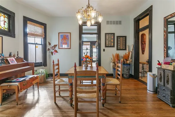 a view of a livingroom with furniture window and wooden floor