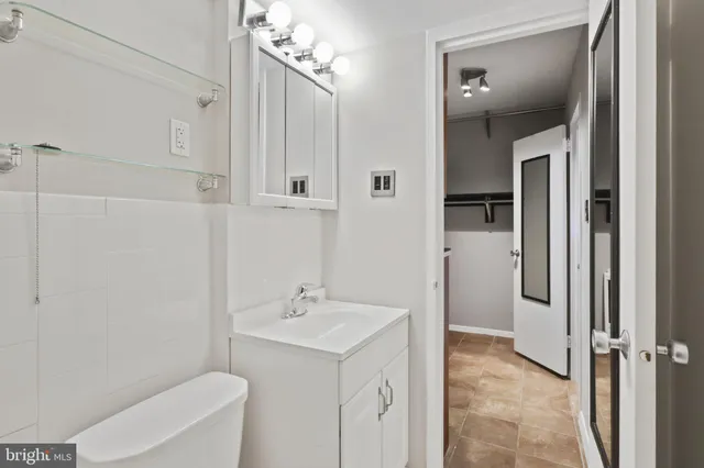 a kitchen with a refrigerator and a sink
