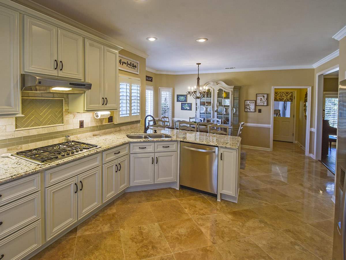 1714 John Ridge Drive Collierville, TN 38017 - Photo 6 of 23 The fully re-made kitchen has knockout cabinetry and high-end stainless appliances..a cooks dream. The large pantry is also a dream for those who like to stock up.
