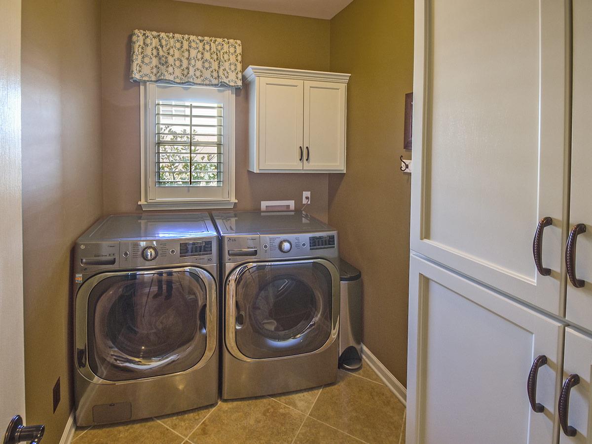 1714 John Ridge Drive Collierville, TN 38017 - Photo 9 of 23 I don't often show a laundry room,but this one is exceptional. The laundry is large and has a double cabinet featuring the same high-end cabinets as the kitchen.