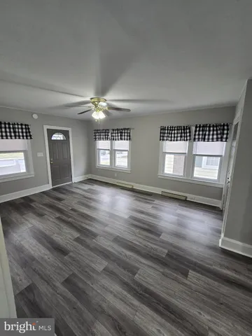 a kitchen with a sink a stove and cabinets