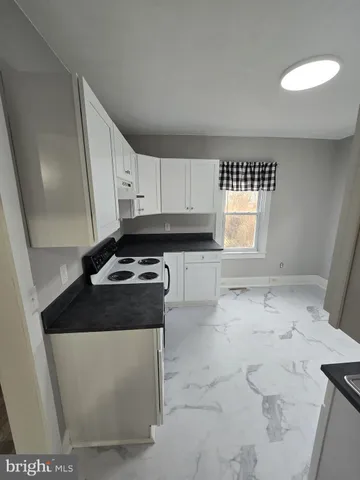 an empty room with a empty space and windows