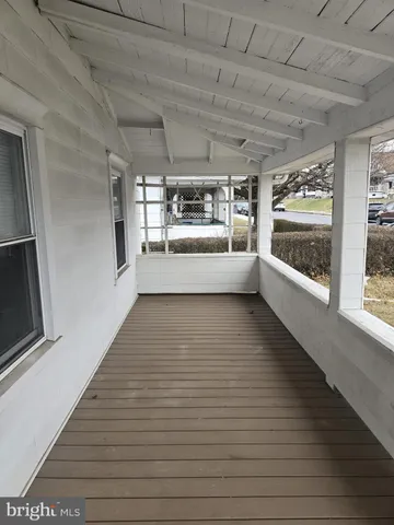 front view of a house with large windows