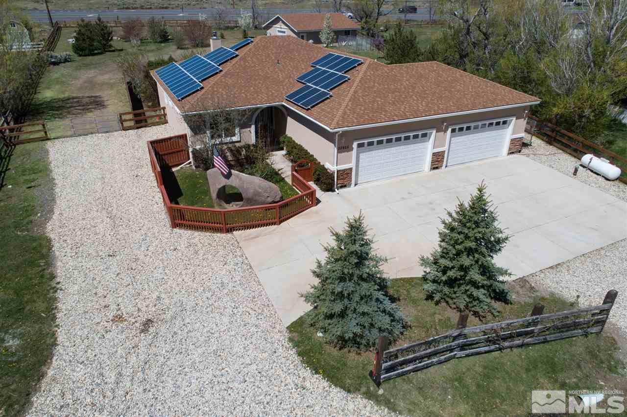 22925 Carriage Drive Reno, NV 89521 - Photo 1 of 24 an aerial view of a house with swimming pool and big yard