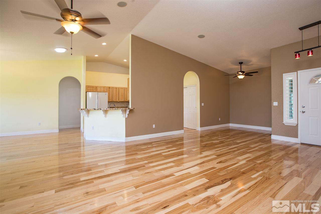 22925 Carriage Drive Reno, NV 89521 - Photo 21 of 24 a view of empty room with wooden floor and fan