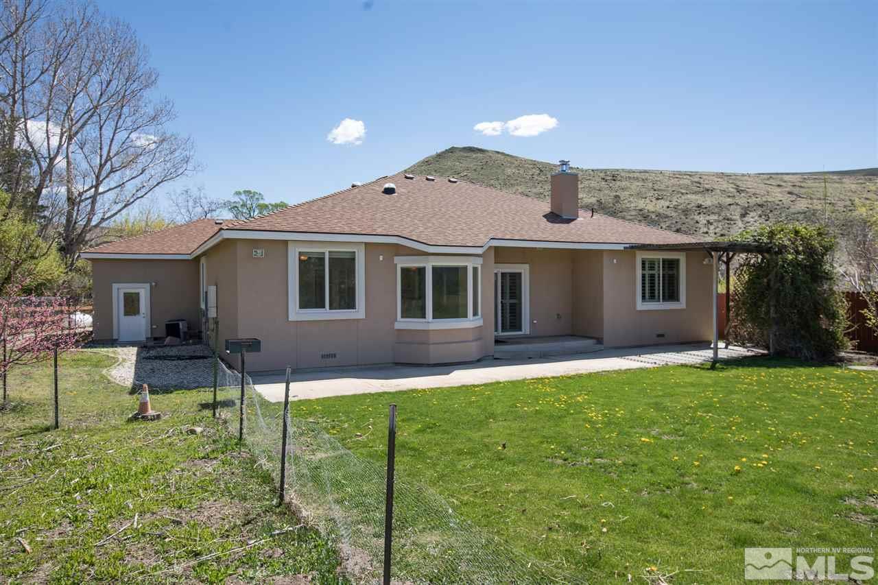 22925 Carriage Drive Reno, NV 89521 - Photo 4 of 24 a backyard of a house with table and chairs