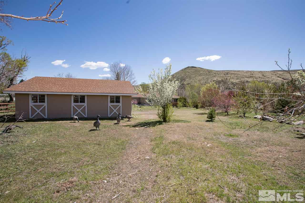 22925 Carriage Drive Reno, NV 89521 - Photo 5 of 24 a view of a house with a backyard