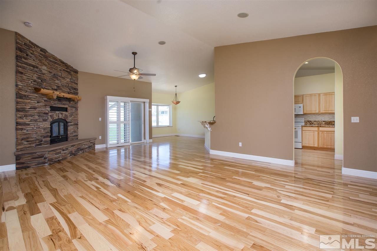 22925 Carriage Drive Reno, NV 89521 - Photo 7 of 24 a view of a livingroom with wooden floor and furniture