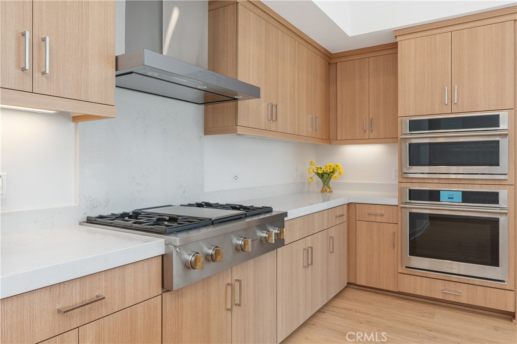 1601 Rivington Irvine, CA 92612 - Photo 12 of 29 a kitchen with granite countertop a stove sink and cabinets