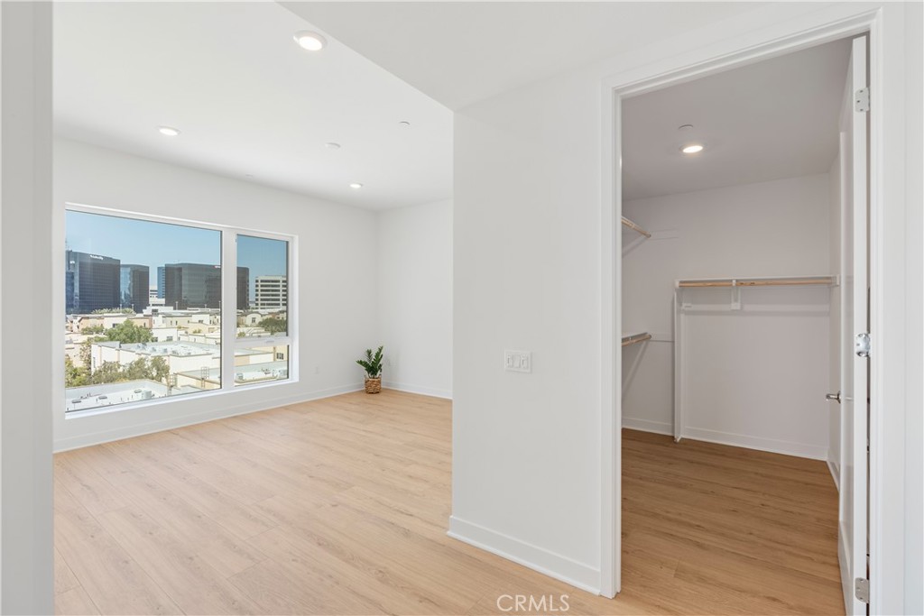 1601 Rivington Irvine, CA 92612 - Photo 14 of 29 a view of an empty room with wooden floor and a window
