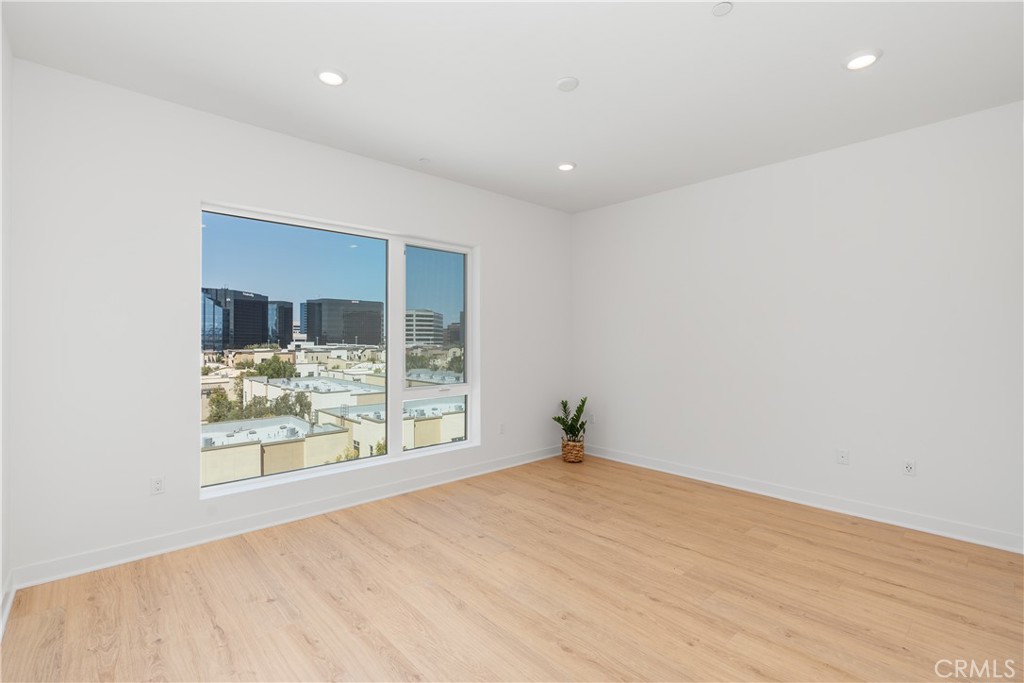 1601 Rivington Irvine, CA 92612 - Photo 15 of 29 an empty room with wooden floor and windows