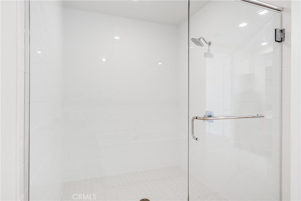1601 Rivington Irvine, CA 92612 - Photo 18 of 29 a bathroom with a shower and a glass door