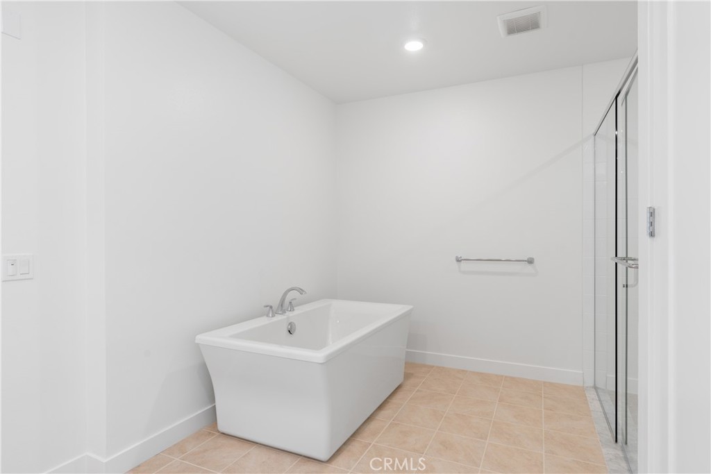 1601 Rivington Irvine, CA 92612 - Photo 19 of 29 a white bath tub sitting in a bathroom